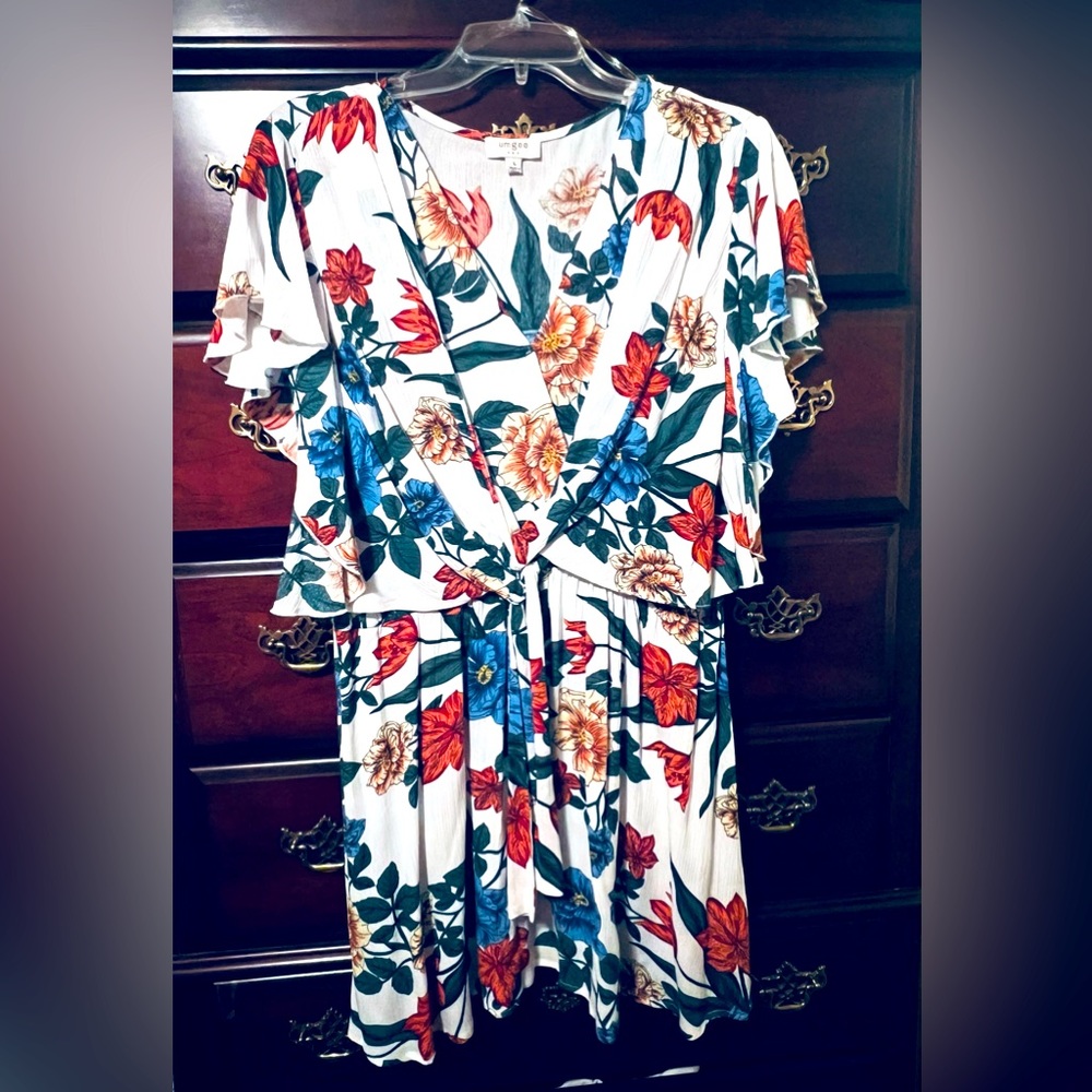 Lightweight flattery floral print with ruffled sleeves and tie on front